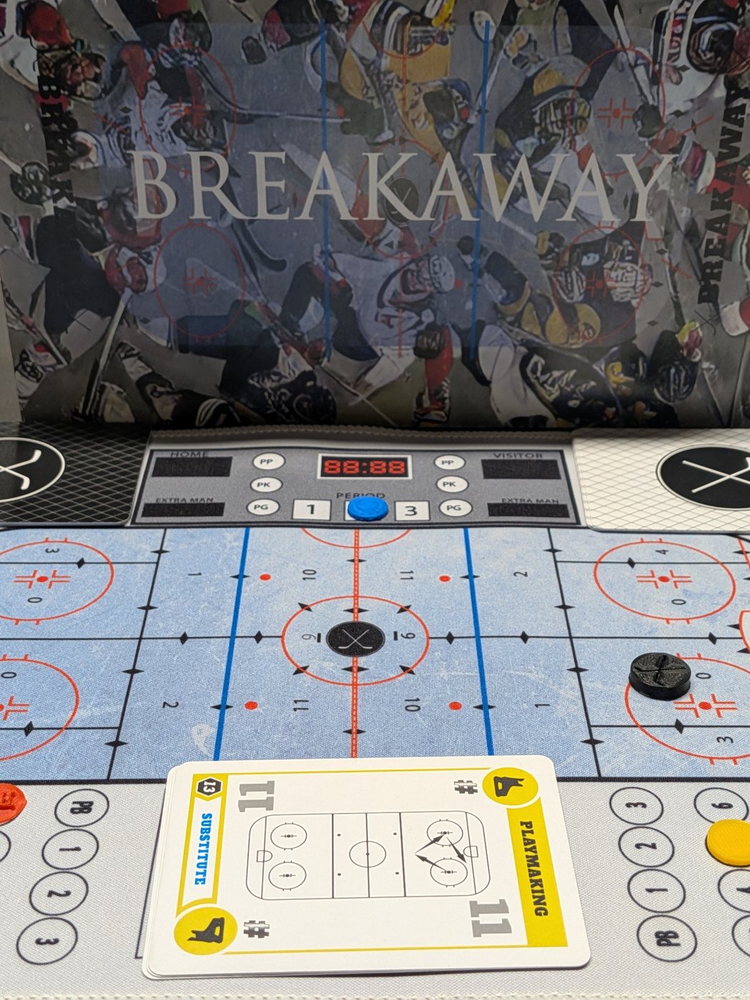 Breakaway box with the game board, scoreboard, and cards set up for play