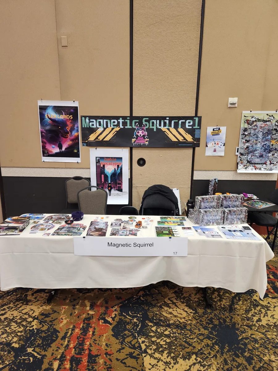 The Magnetic Squirrel booth at SaltCon 2024 with Breakaway on the table